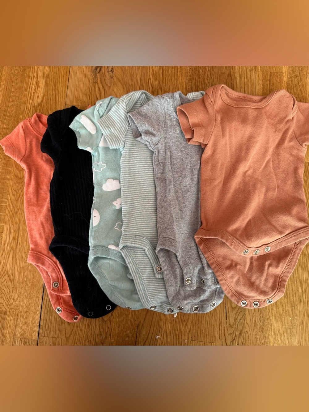 Six short sleeve newborn onesies